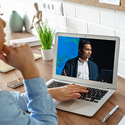 women watching online conference