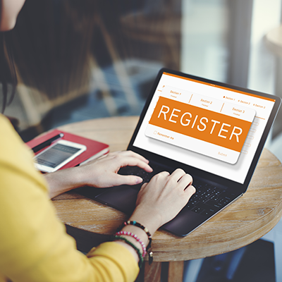 woman registering on laptop